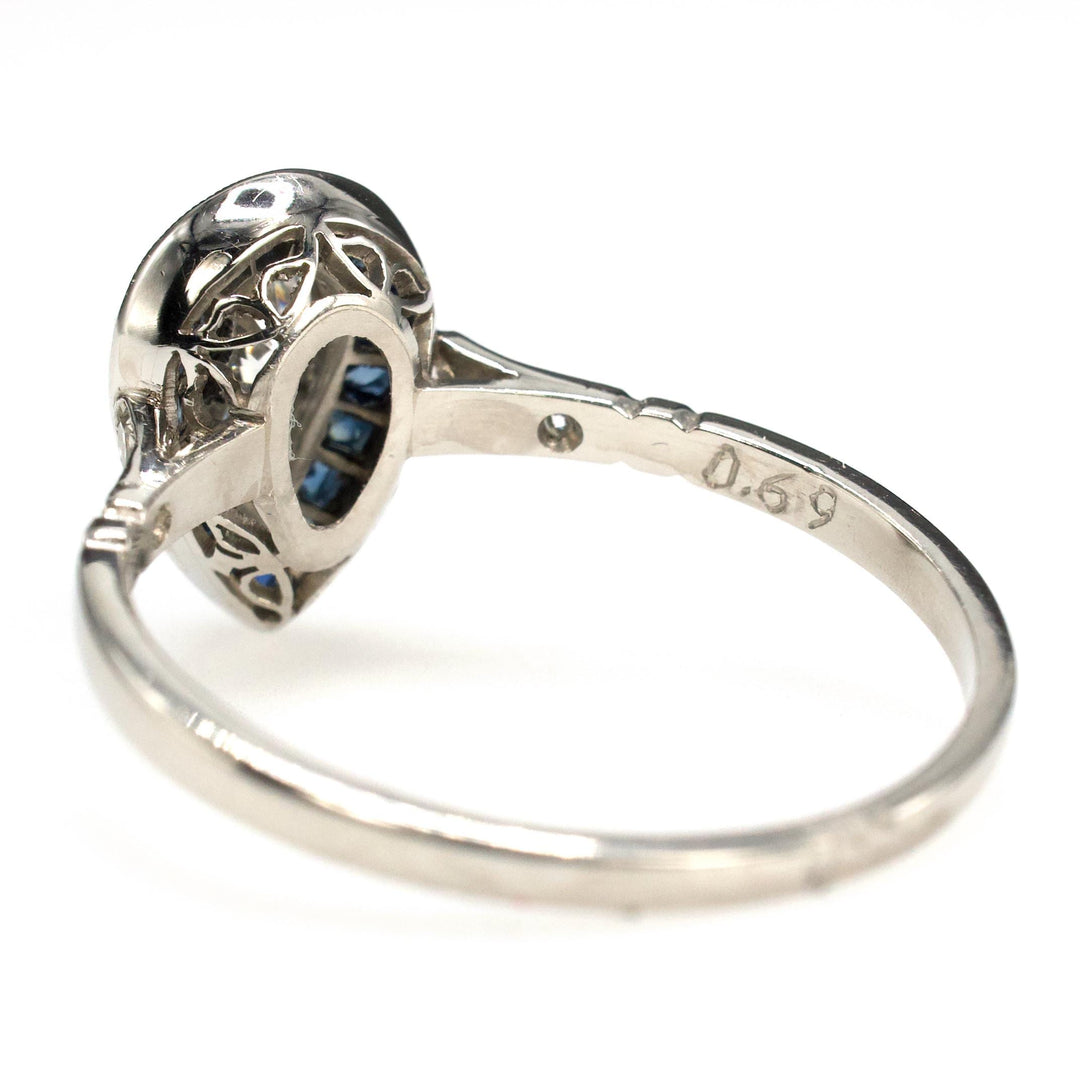 Art Deco Style Platinum Ring with 0.69 Carat Pear Cut Diamond and Sapphire Halo