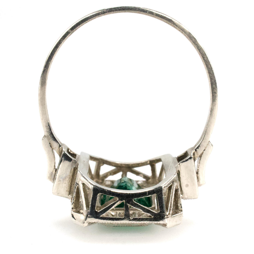 Estate 1.40 Carat Emerald Cut Emerald in Art Deco Style White Gold Setting with Diamond Halo