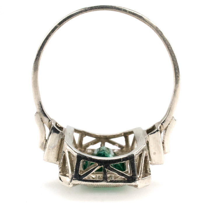 Estate 1.40 Carat Emerald Cut Emerald in Art Deco Style White Gold Setting with Diamond Halo