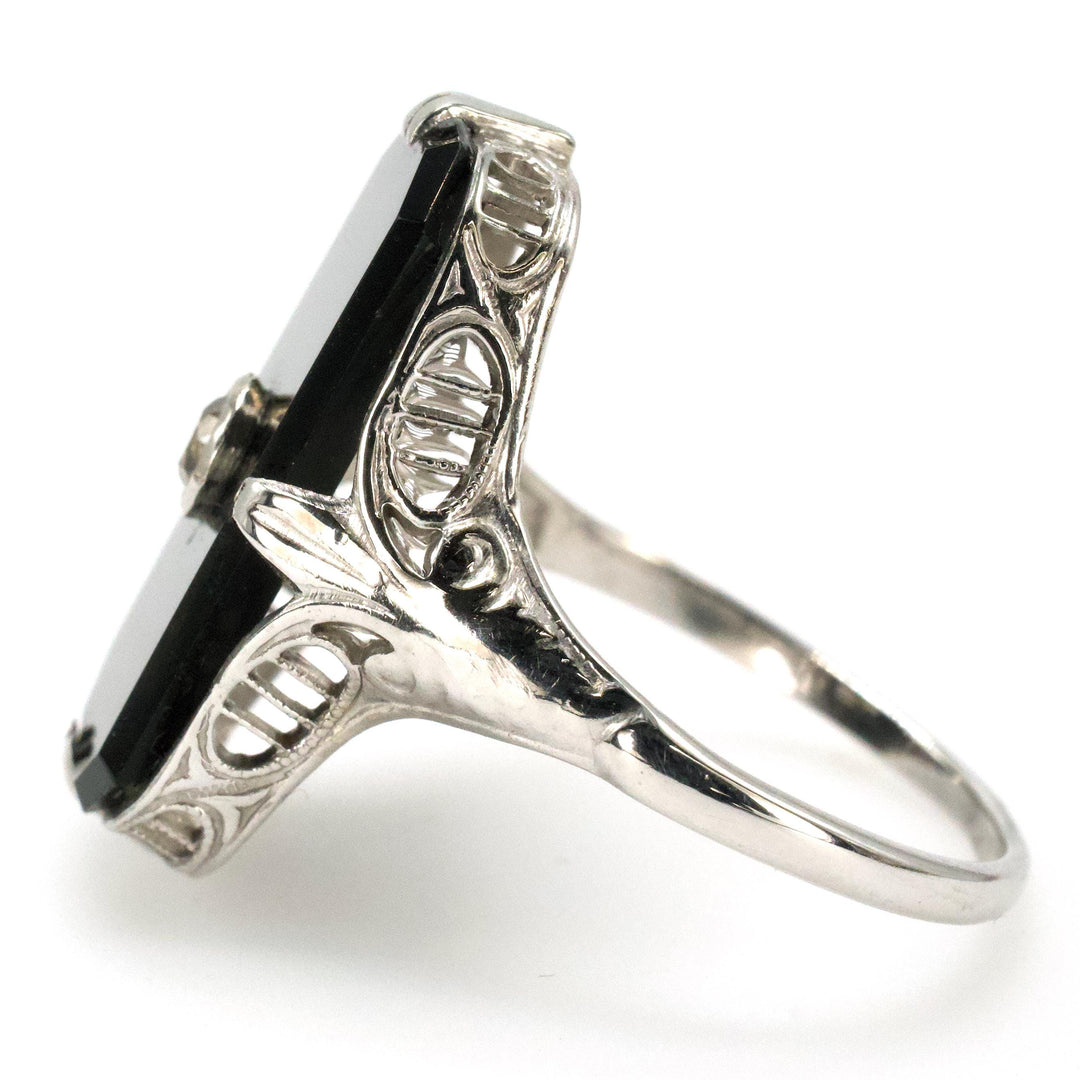 Antique White Gold Filigree Ring with Buff Top Onyx and Bezel set Diamond
