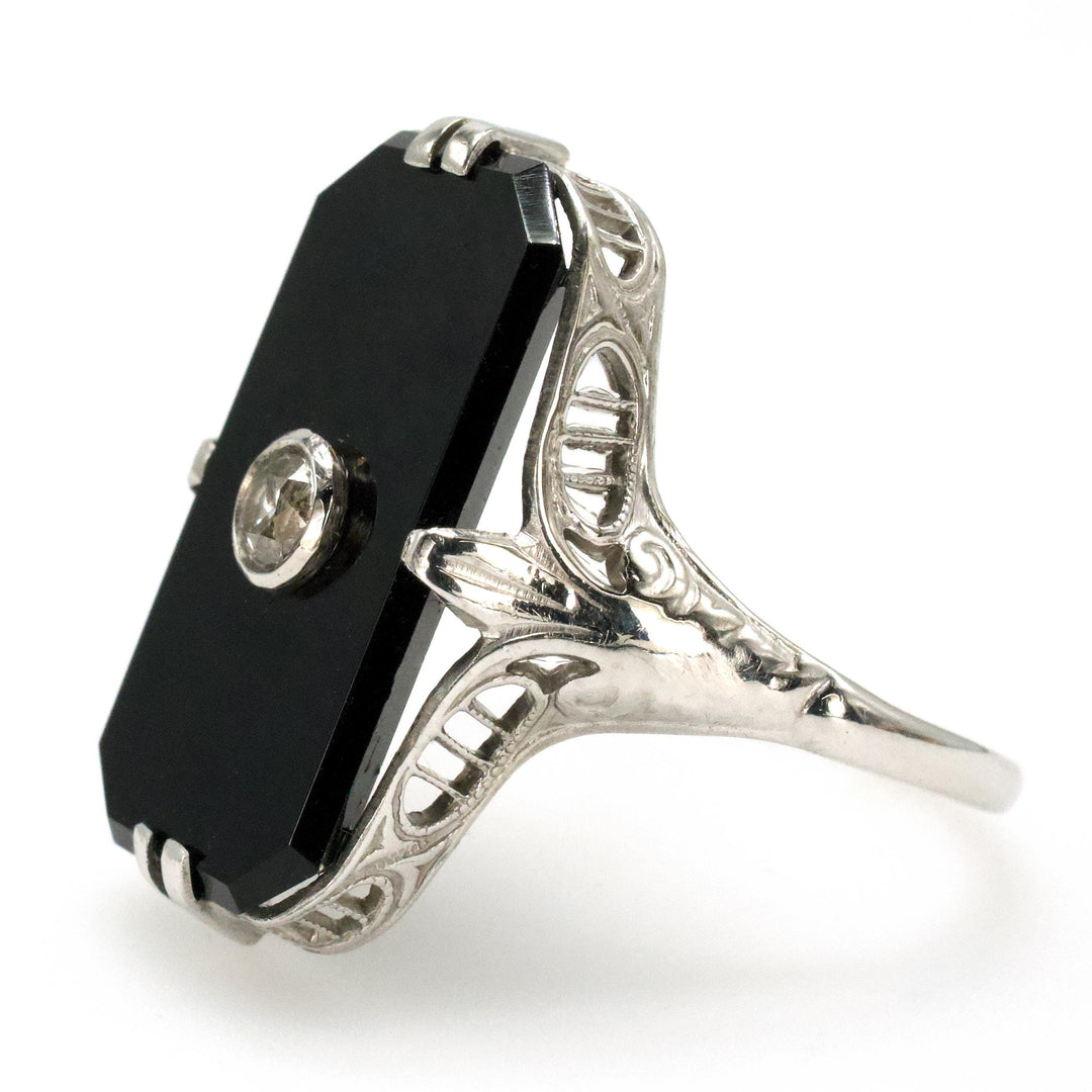Antique White Gold Filigree Ring with Buff Top Onyx and Bezel set Diamond