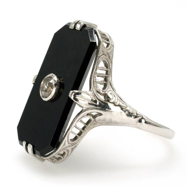Antique White Gold Filigree Ring with Buff Top Onyx and Bezel set Diamond