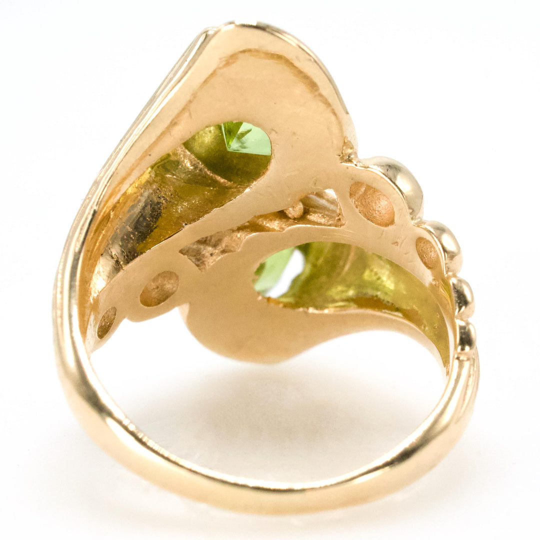 Unusual Two Stone Peridot Bypass Ring in 14K Yellow Gold