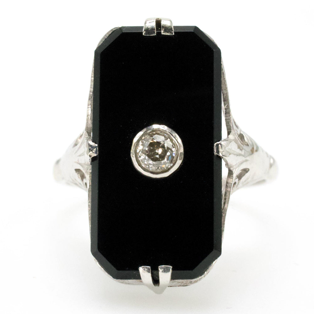 Antique White Gold Filigree Ring with Buff Top Onyx and Bezel set Diamond