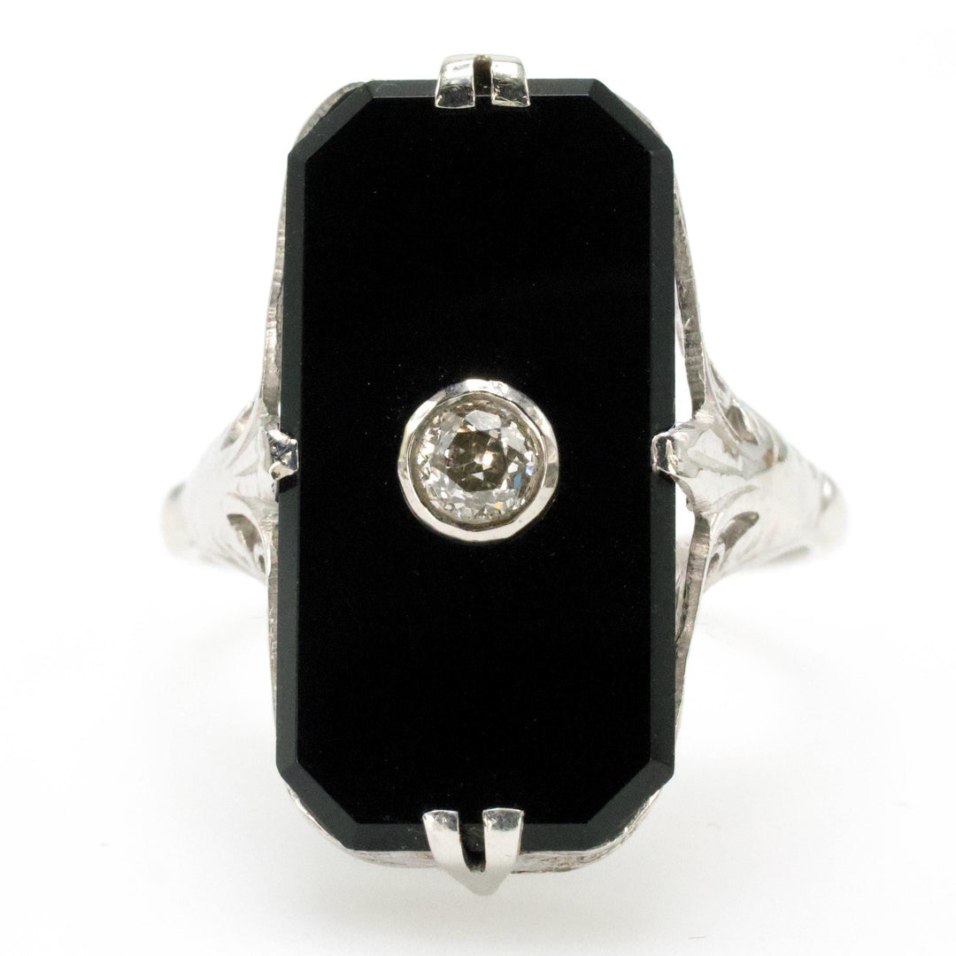Antique White Gold Filigree Ring with Buff Top Onyx and Bezel set Diamond