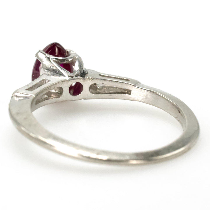 Pear Shaped Cabochon Ruby Platinum Ring with Tapered Baguette Diamond Accents