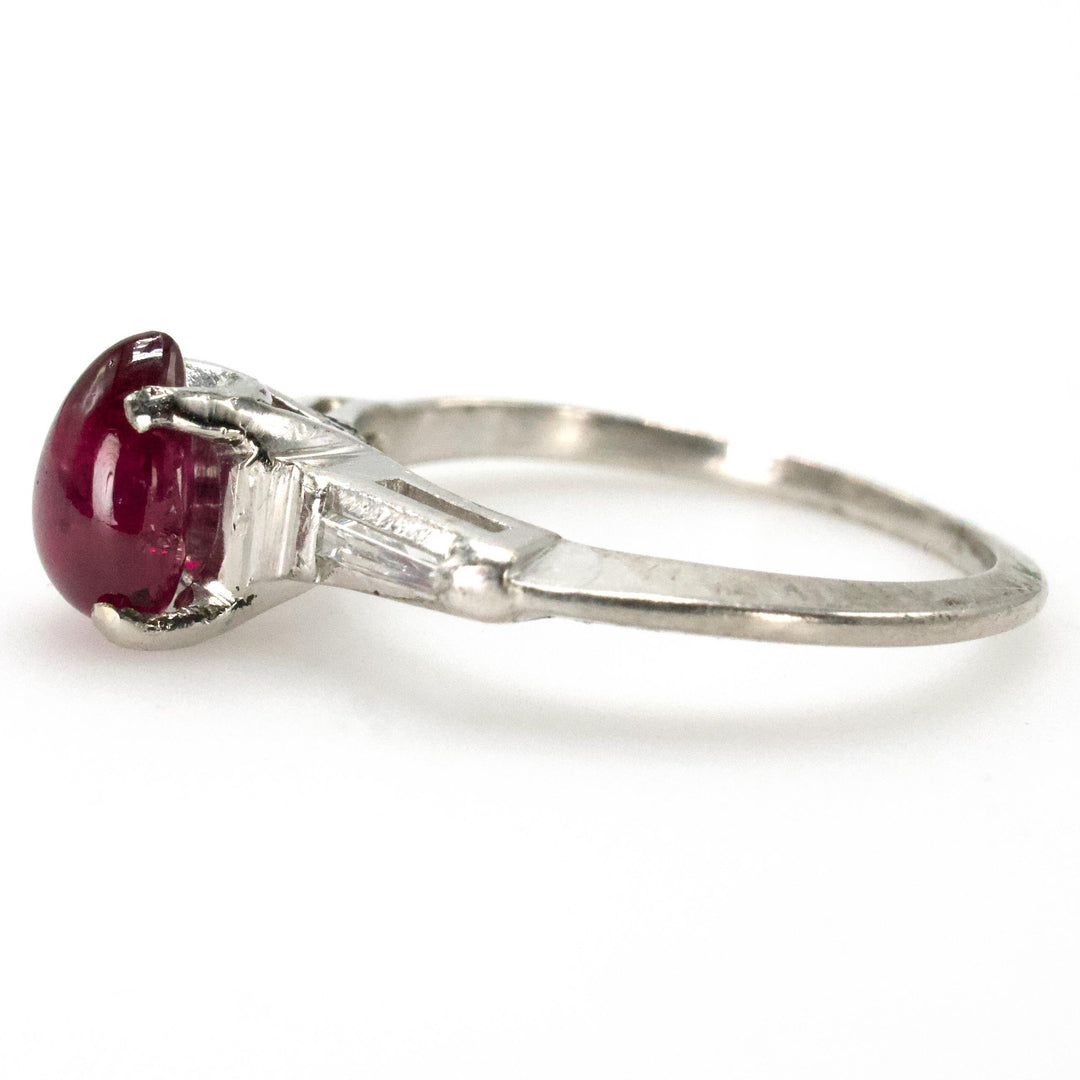 Pear Shaped Cabochon Ruby Platinum Ring with Tapered Baguette Diamond Accents