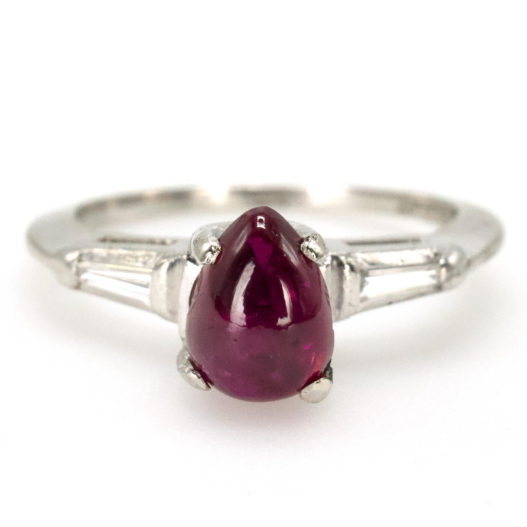 Pear Shaped Cabochon Ruby Platinum Ring with Tapered Baguette Diamond Accents