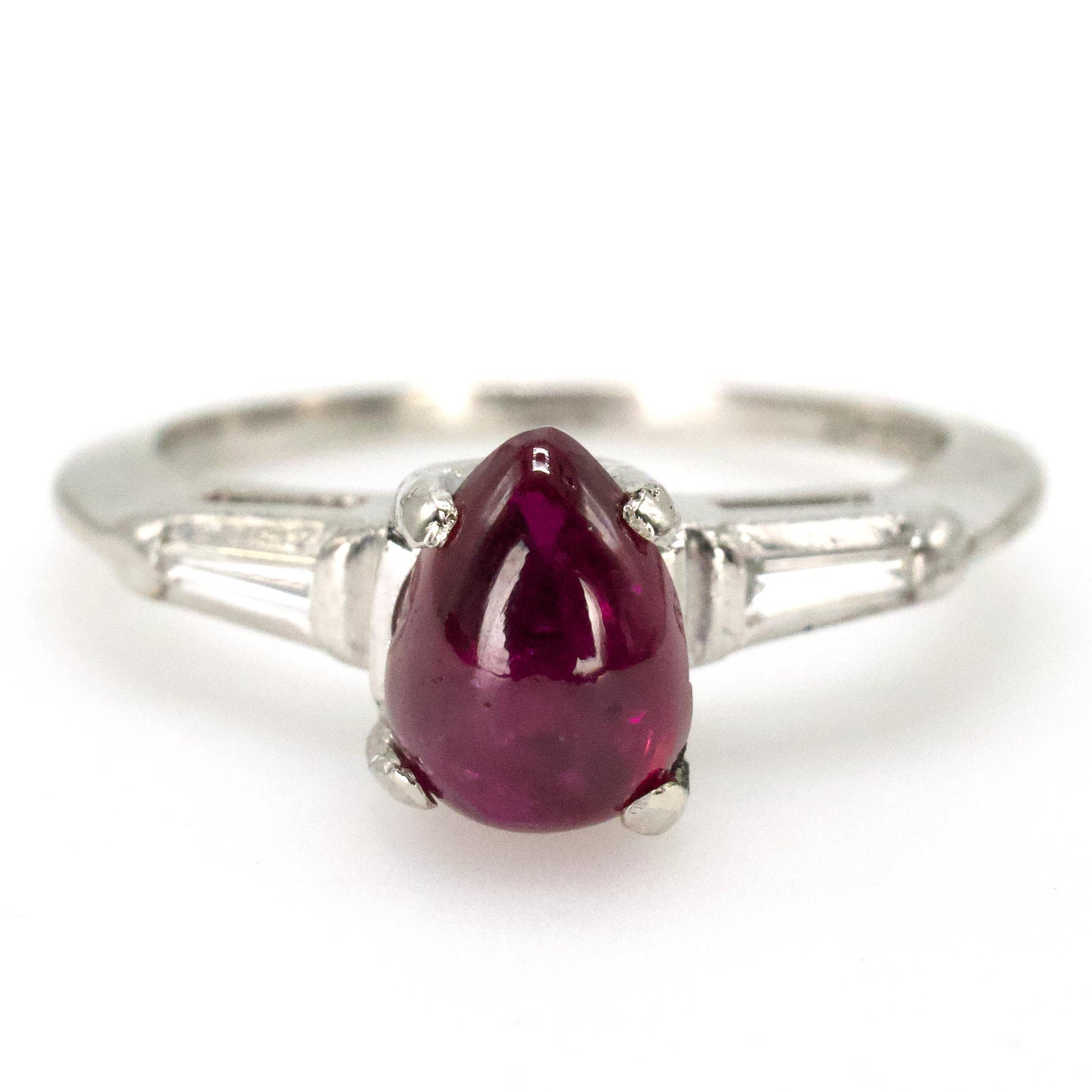 Pear Shaped Cabochon Ruby Platinum Ring with Tapered Baguette Diamond Accents