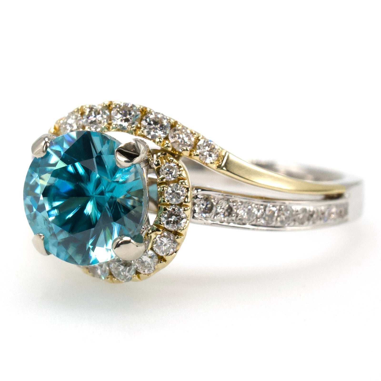 1.78 Carat Blue Topaz Bypass Ring with Asymmetrical Diamond Halo in Bicolor Gold