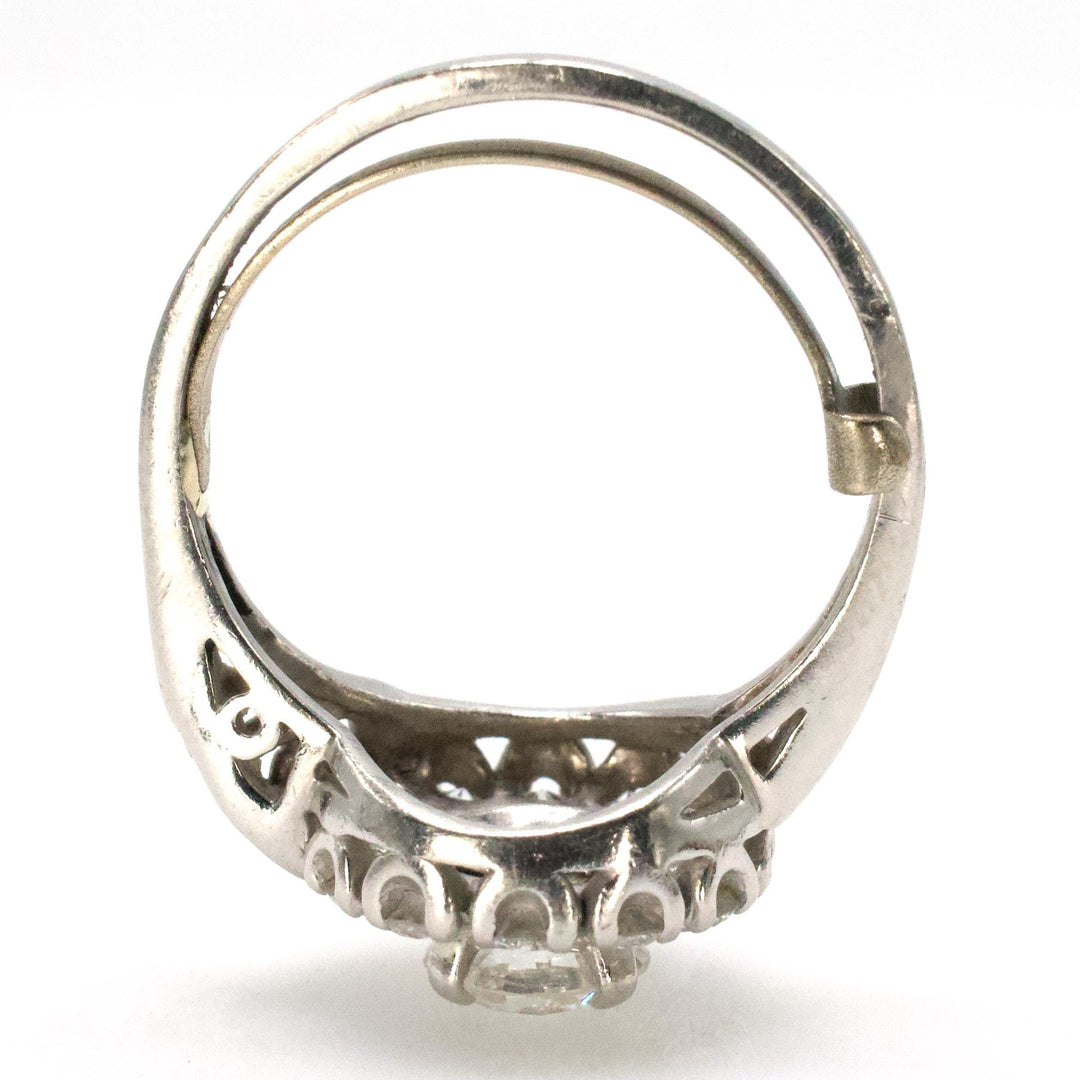 Midcentury Asymmetric Round Brilliant Diamond Ring with Partial Halo and Accent Baguettes