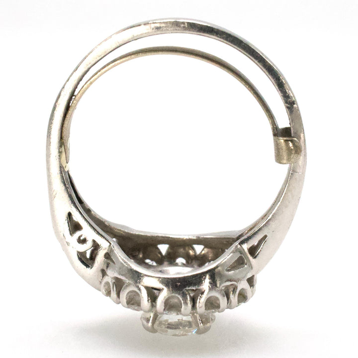 Midcentury Asymmetric Round Brilliant Diamond Ring with Partial Halo and Accent Baguettes