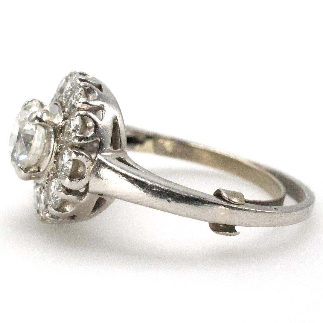 Midcentury Asymmetric Round Brilliant Diamond Ring with Partial Halo and Accent Baguettes