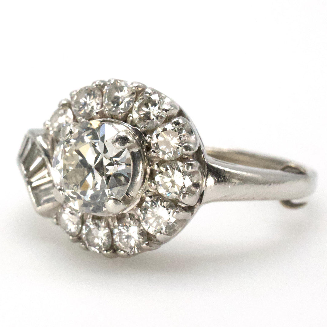 Midcentury Asymmetric Round Brilliant Diamond Ring with Partial Halo and Accent Baguettes