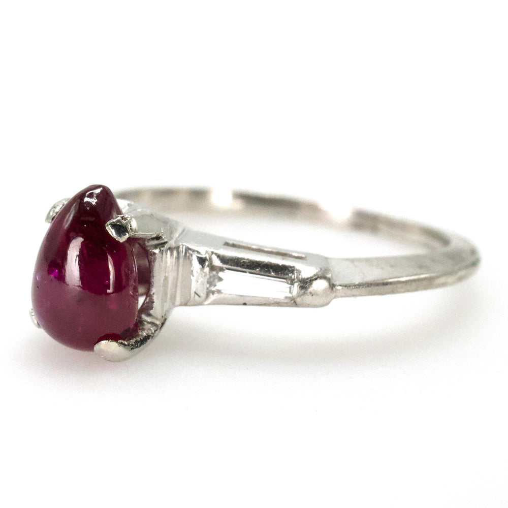 Pear Shaped Cabochon Ruby Platinum Ring with Tapered Baguette Diamond Accents