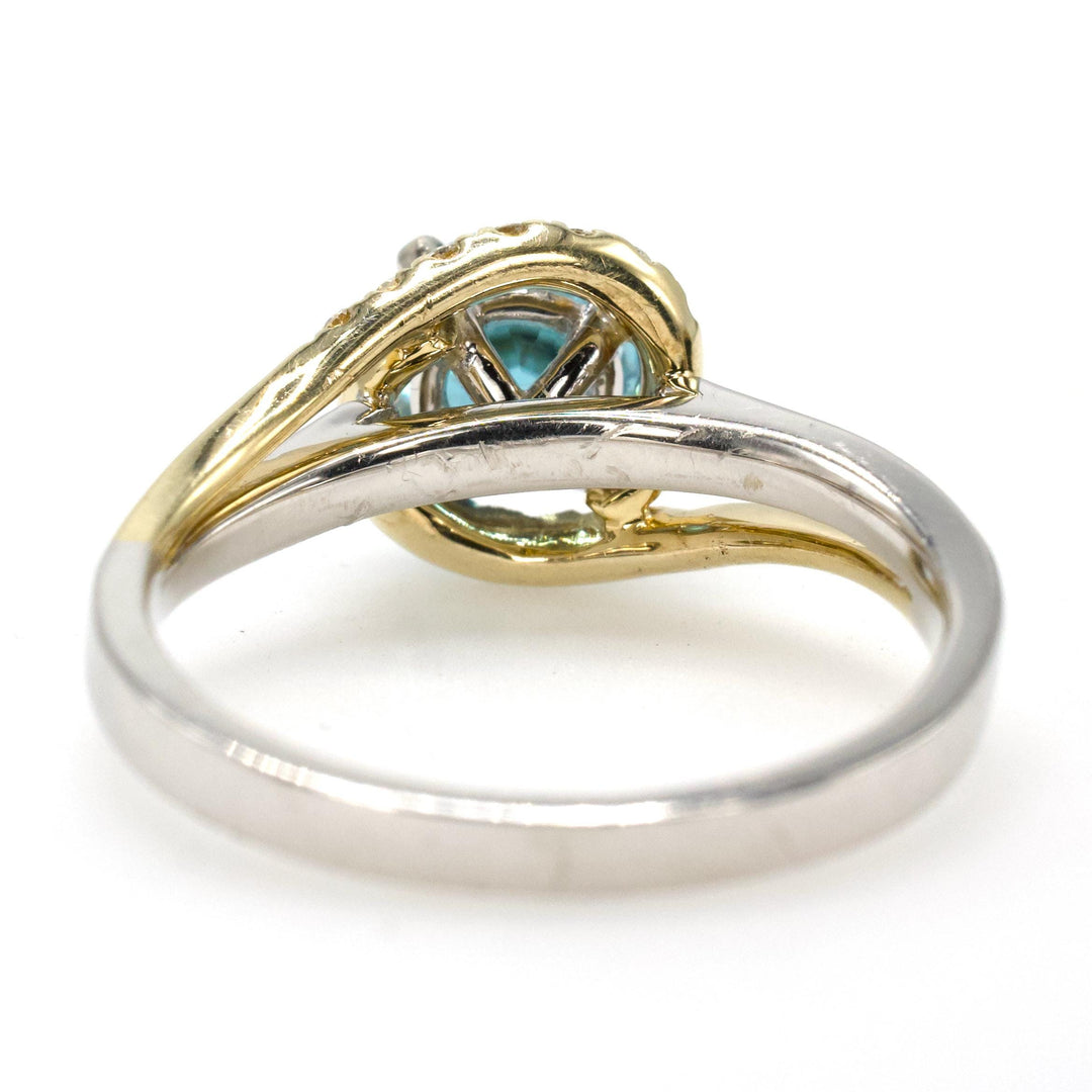 1.78 Carat Blue Topaz Bypass Ring with Asymmetrical Diamond Halo in Bicolor Gold