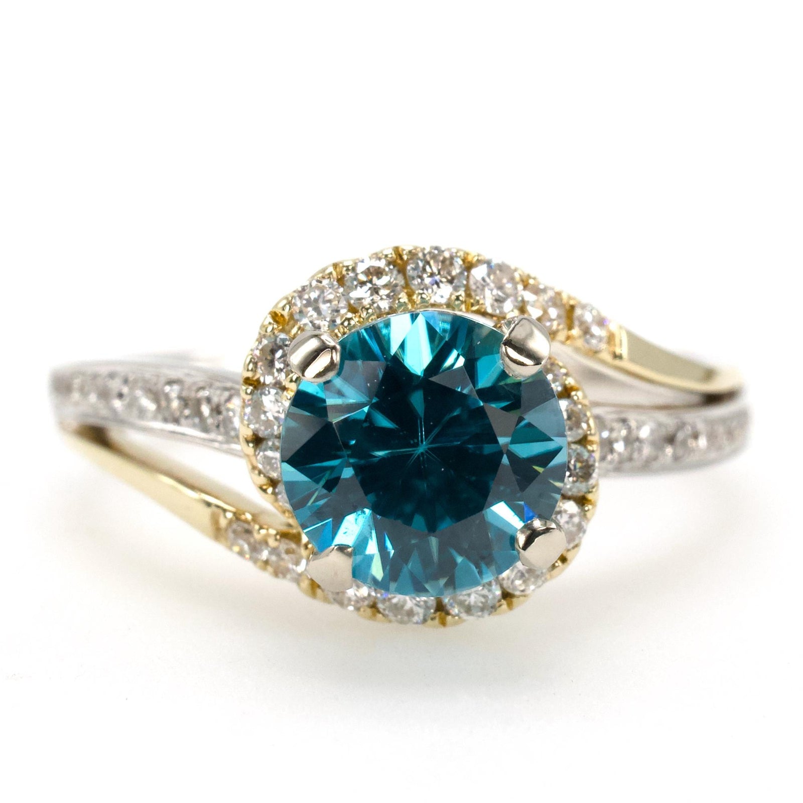 1.78 Carat Blue Topaz Bypass Ring with Asymmetrical Diamond Halo in Bicolor Gold