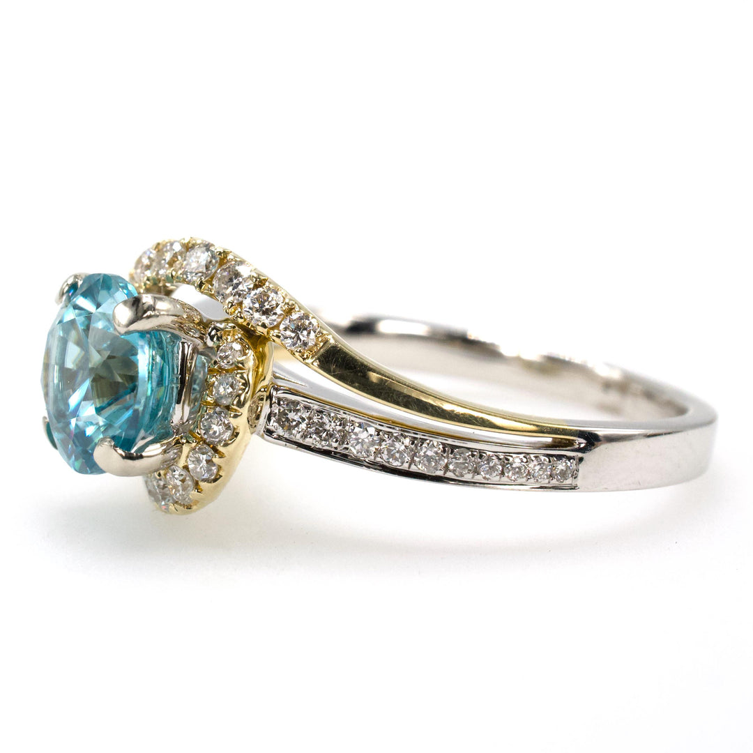 1.78 Carat Blue Topaz Bypass Ring with Asymmetrical Diamond Halo in Bicolor Gold