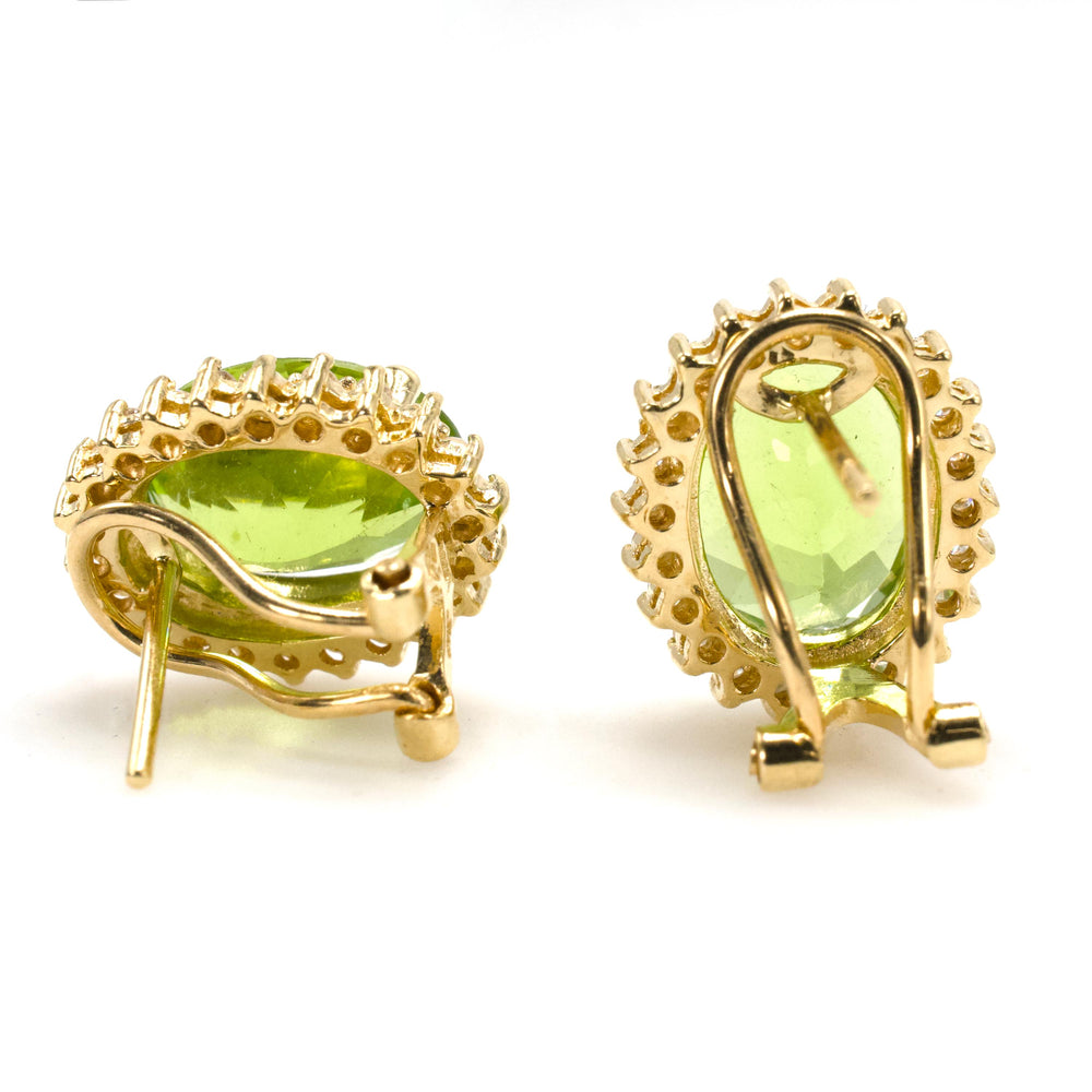 Oval Peridot Omega Back Stud Earrings in Gold with Diamond Halo