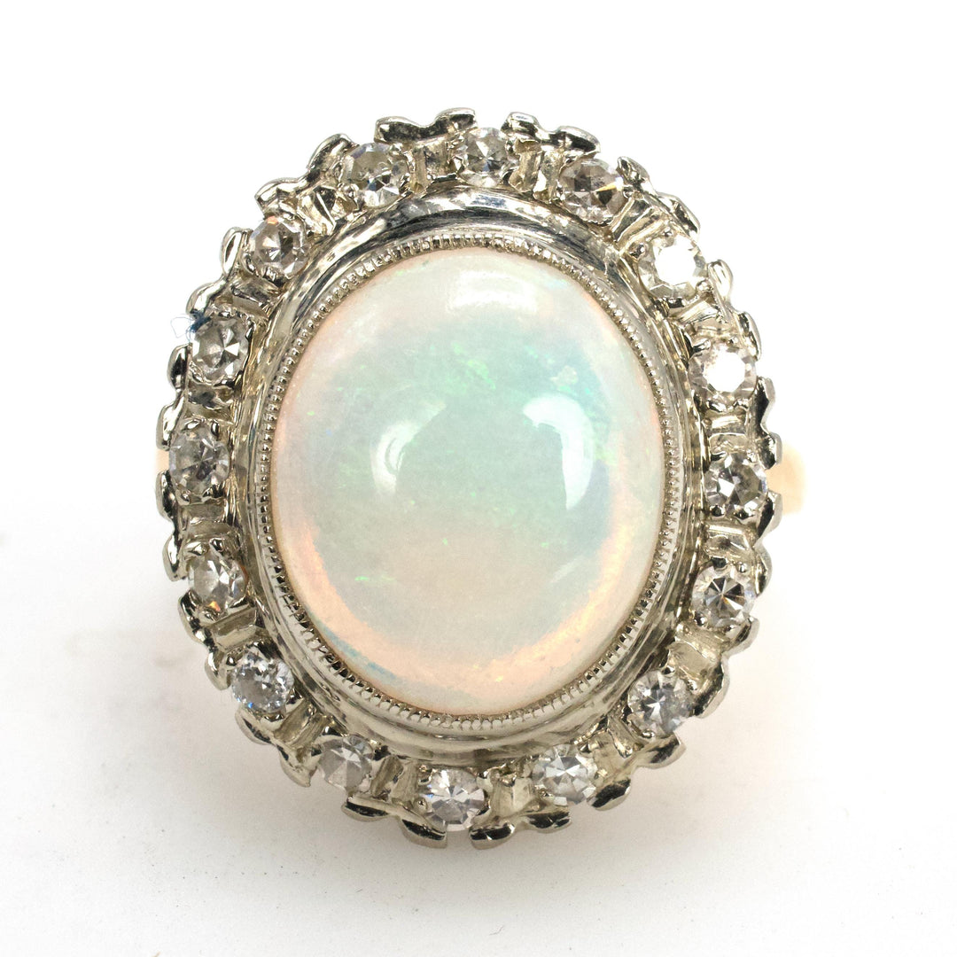 Vintage Gold Oval Opal Ring with Diamond Halo Surround