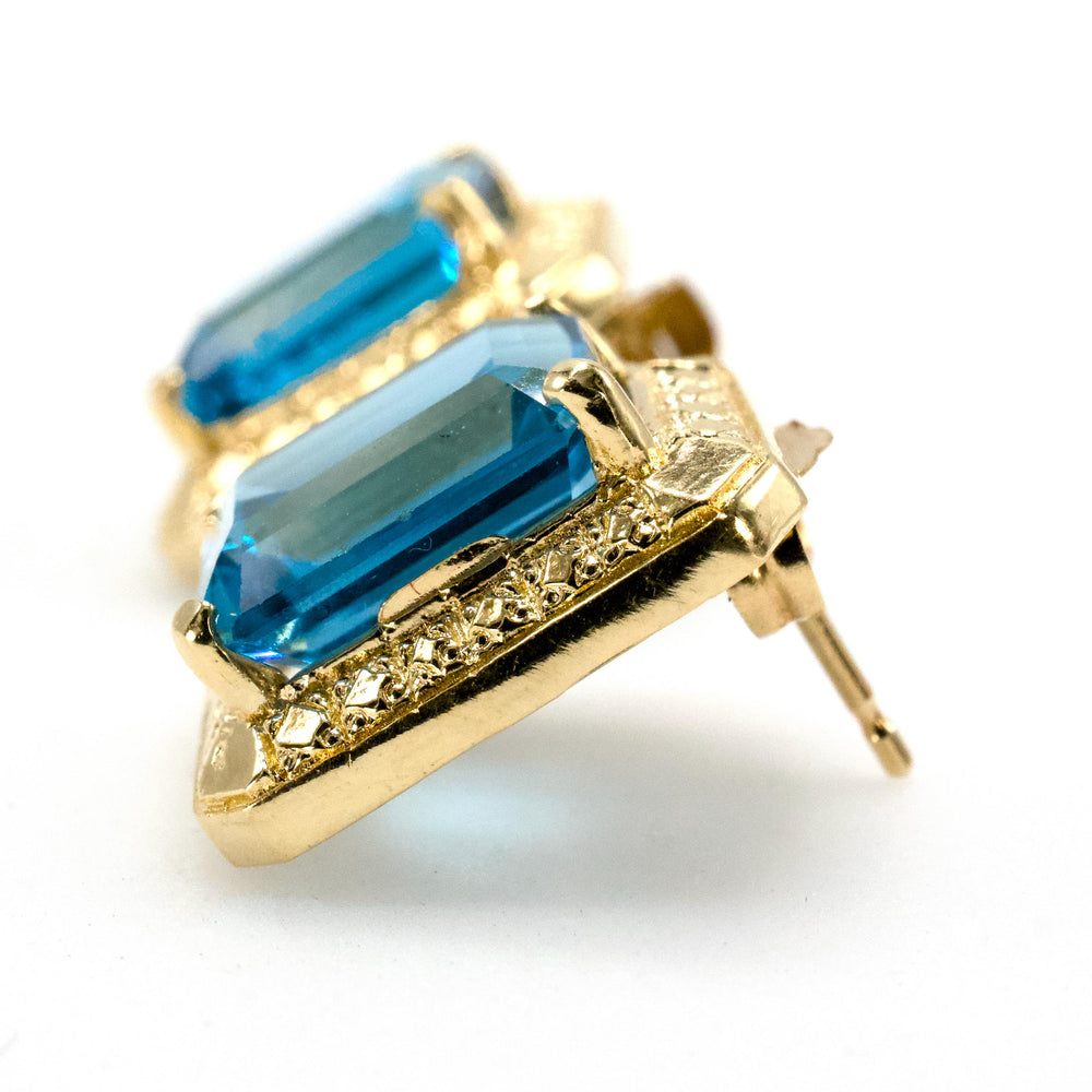Estate 14K Gold and Blue Topaz Emerald Cut Stud Earrings with Textured Halo
