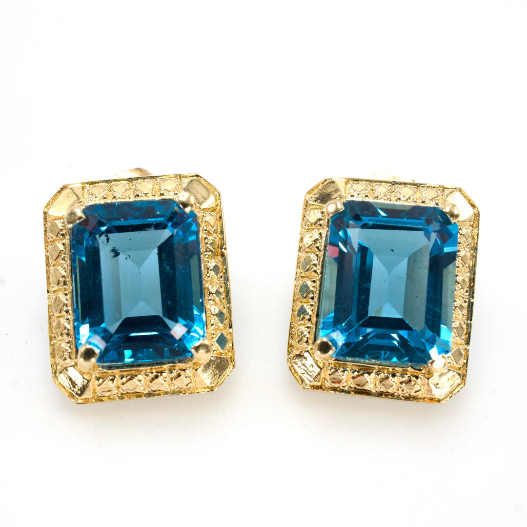 Estate 14K Gold and Blue Topaz Emerald Cut Stud Earrings with Textured Halo