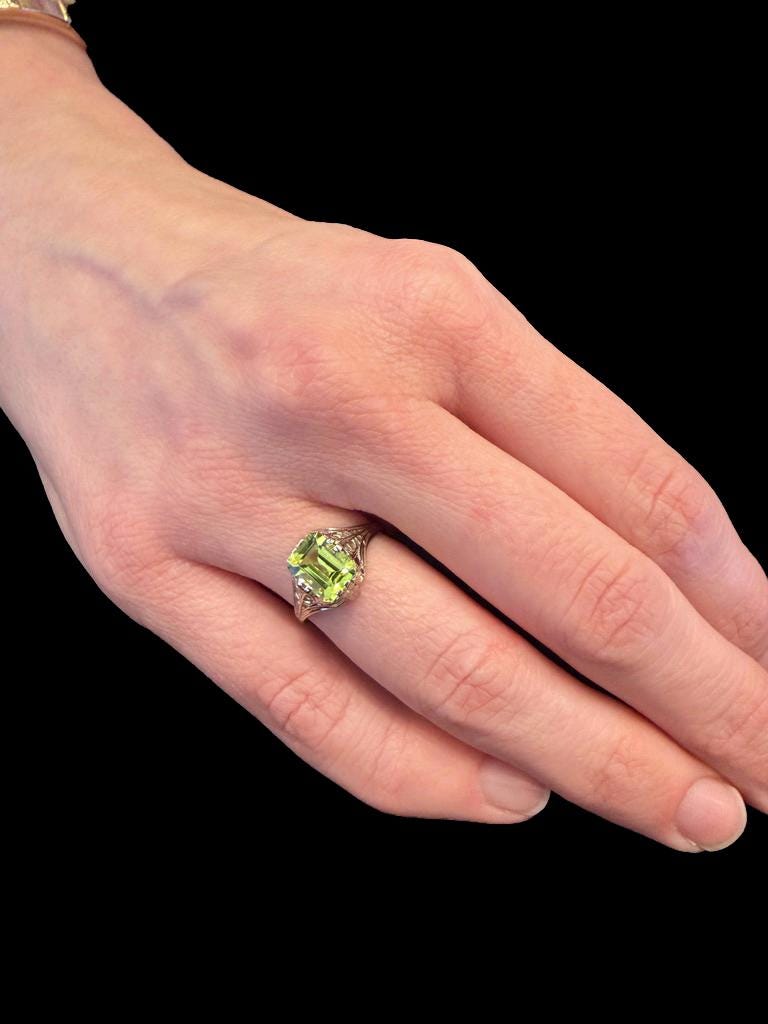 1.75 Carat Emerald Cut Peridot in 1930s Art Deco White Gold Filigree Setting
