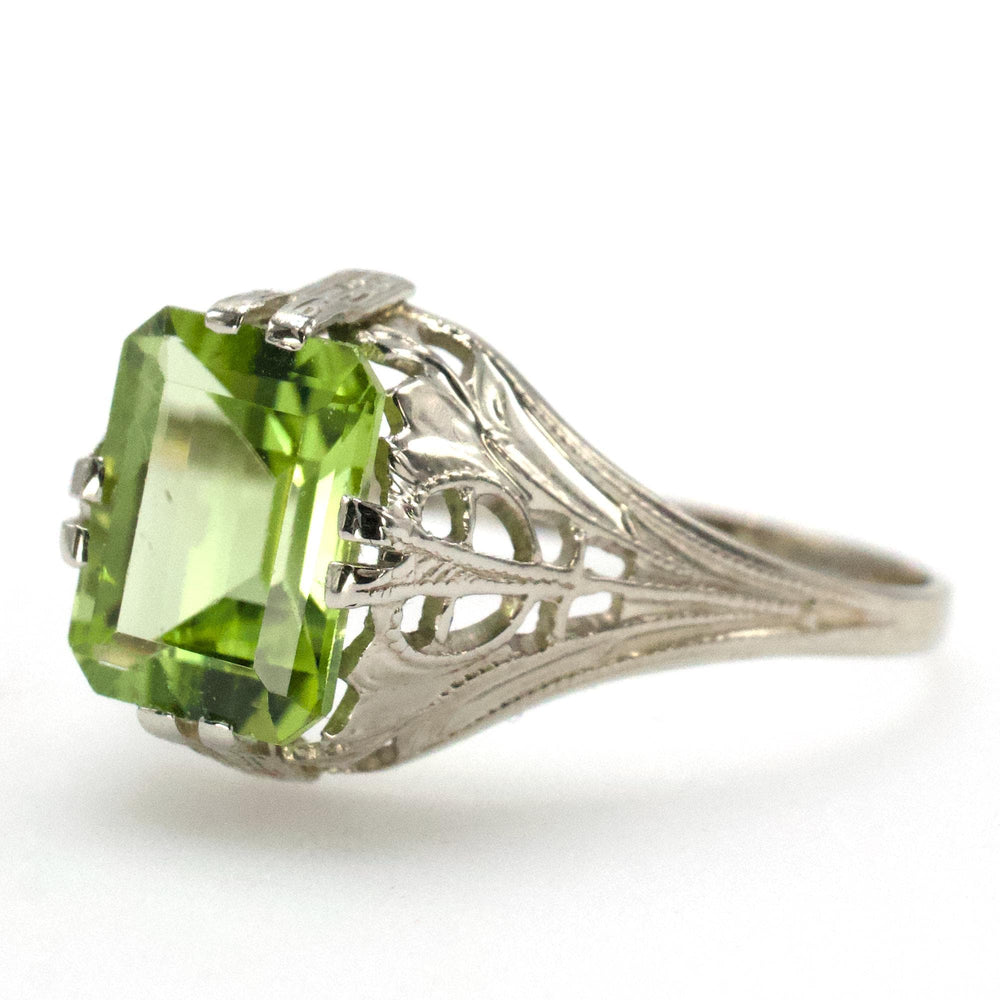 1.75 Carat Emerald Cut Peridot in 1930s Art Deco White Gold Filigree Setting