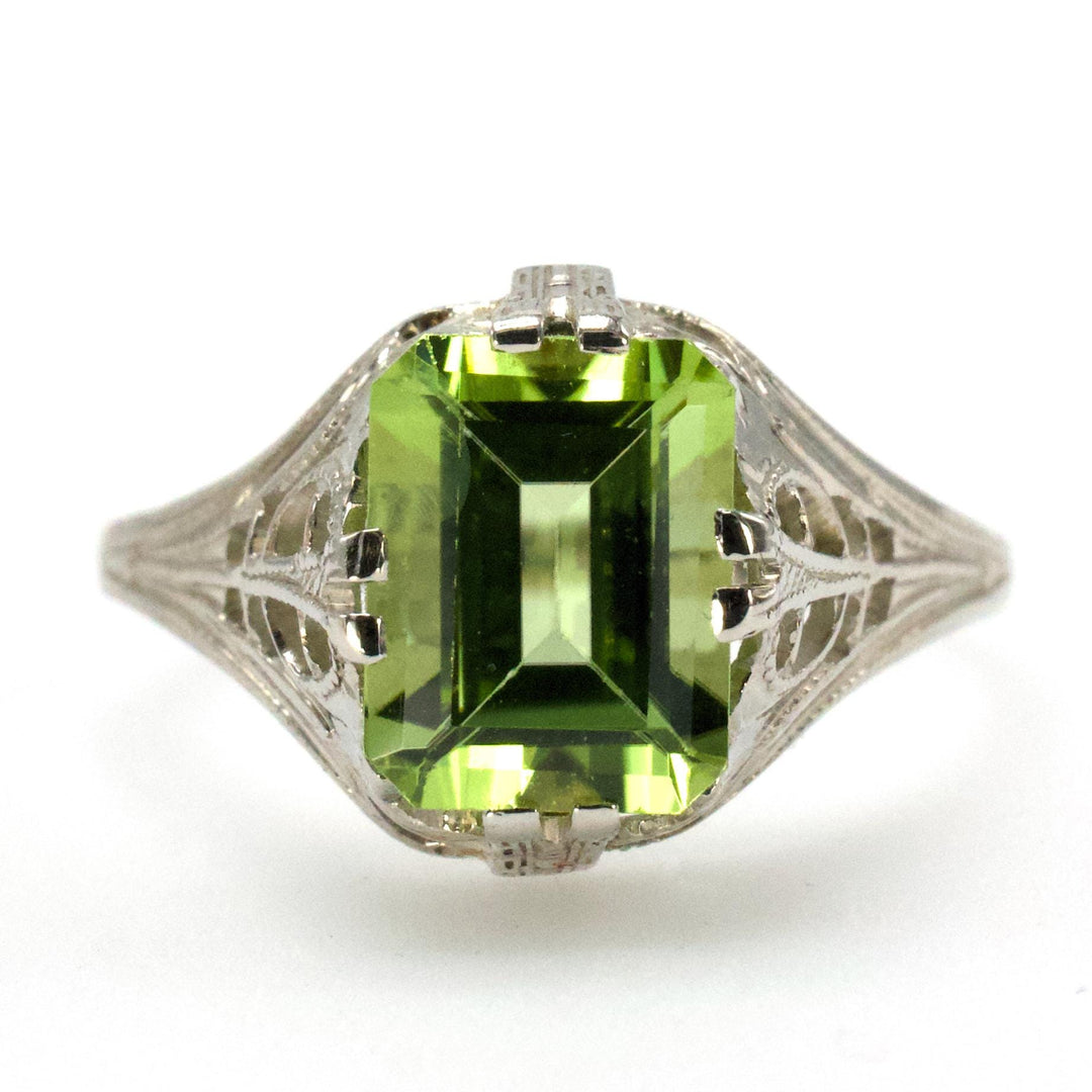 1.75 Carat Emerald Cut Peridot in 1930s Art Deco White Gold Filigree Setting