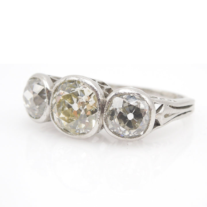 Edwardian Platinum Diamond Three Stone Ring: 2.82ct Filigree & Bezel Set