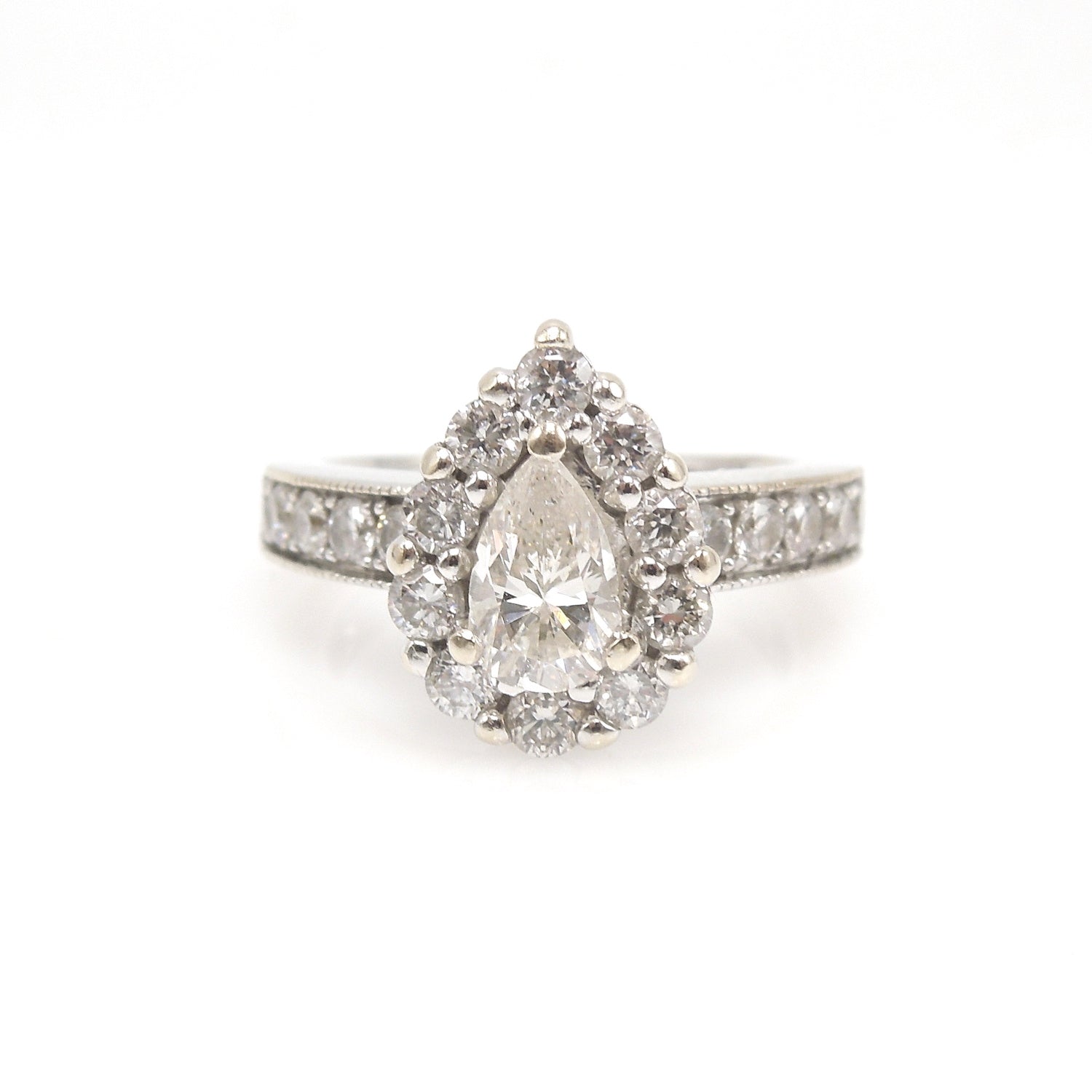 0.61ct Pear Cut Diamond in White Gold with Diamond Halo