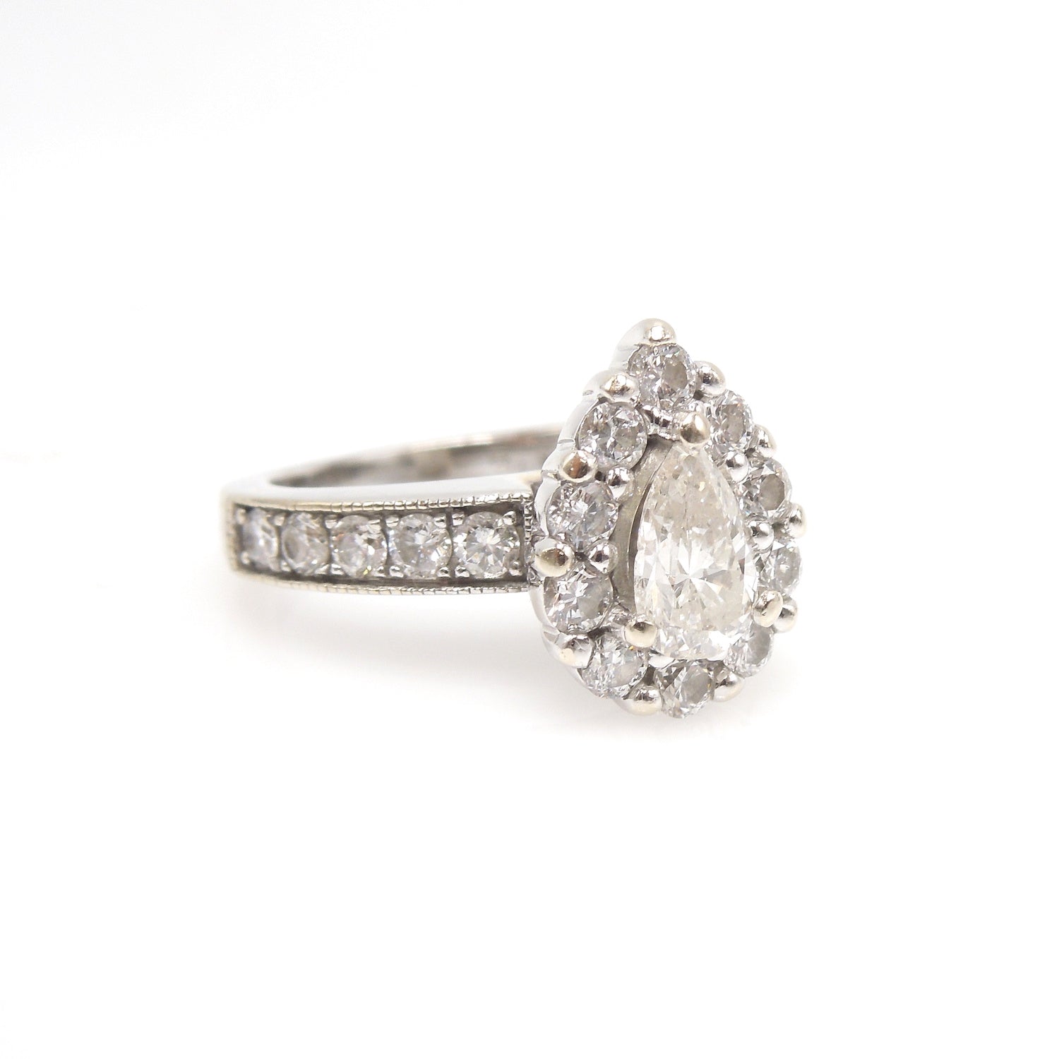 0.61ct Pear Cut Diamond in White Gold with Diamond Halo