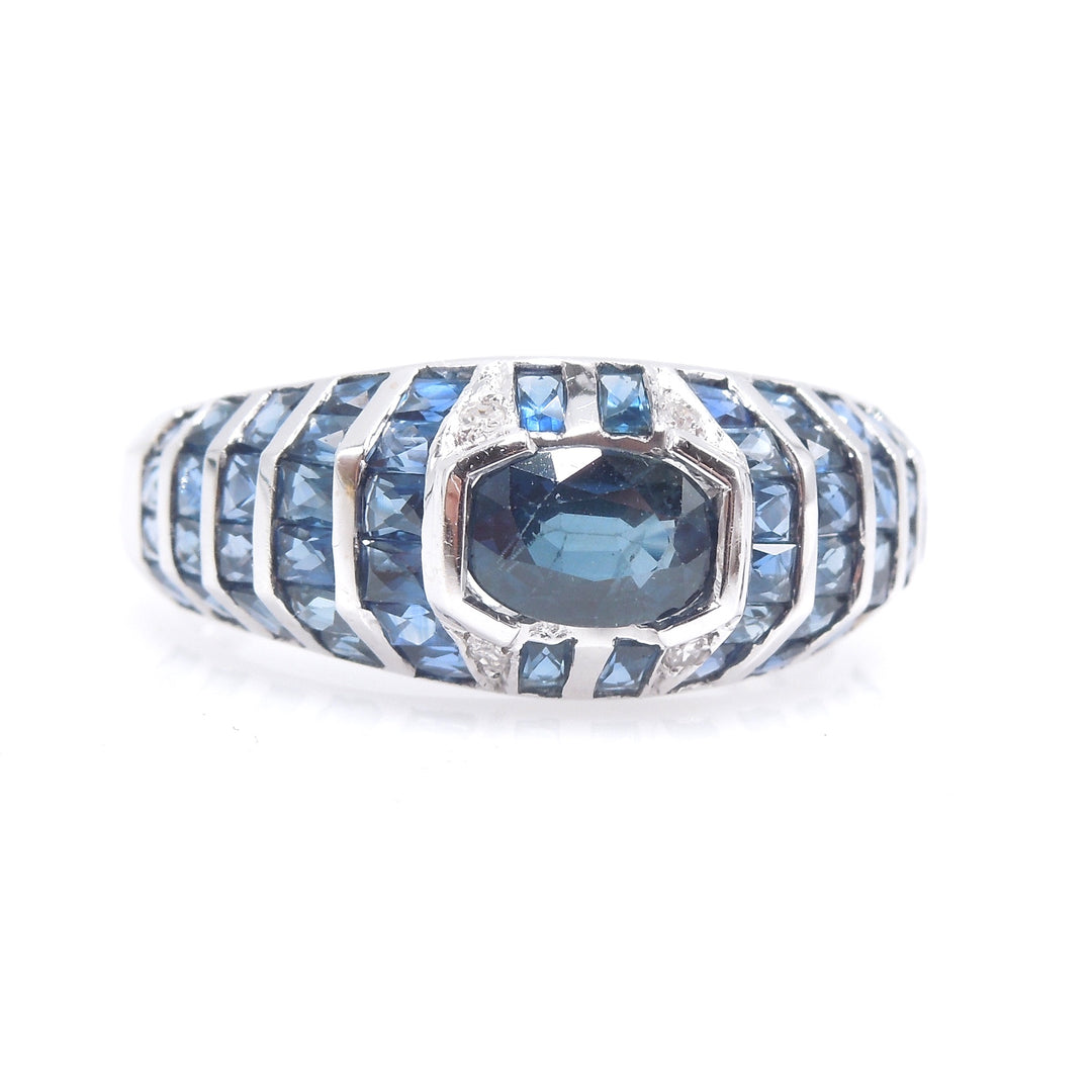 White Gold and Sapphire Bezel and Channel Set Domed Band