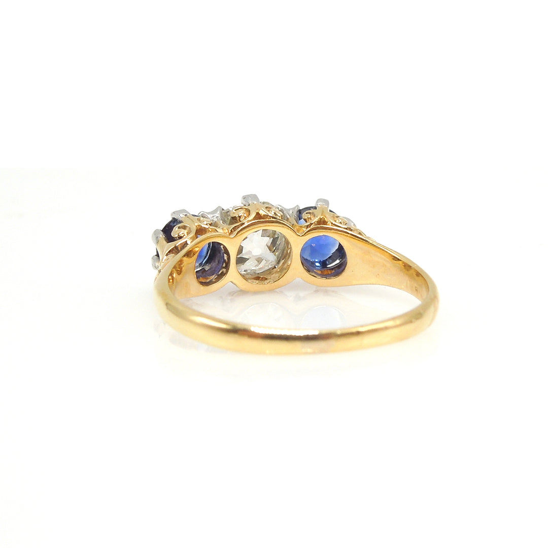 Edwardian Platinum and Yellow Gold Three Stone Ring with Sapphires