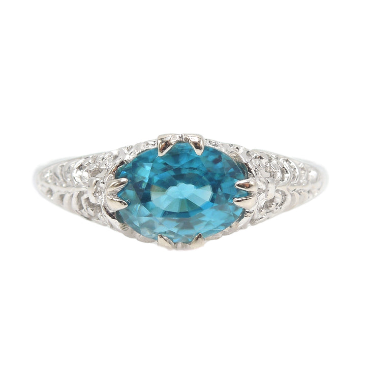 Art Deco Style Filigree Ring in 14K White Gold with Oval Blue Zircon Set East-West