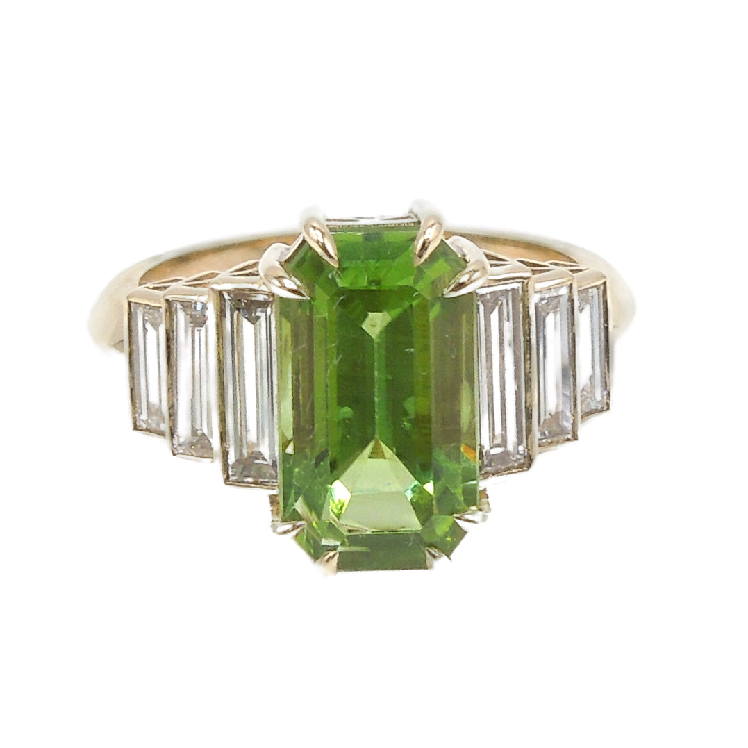 4.58 Carat Elongated Emerald Cut Peridot in Art Deco Style Yellow Gold Mounting with Baguettes
