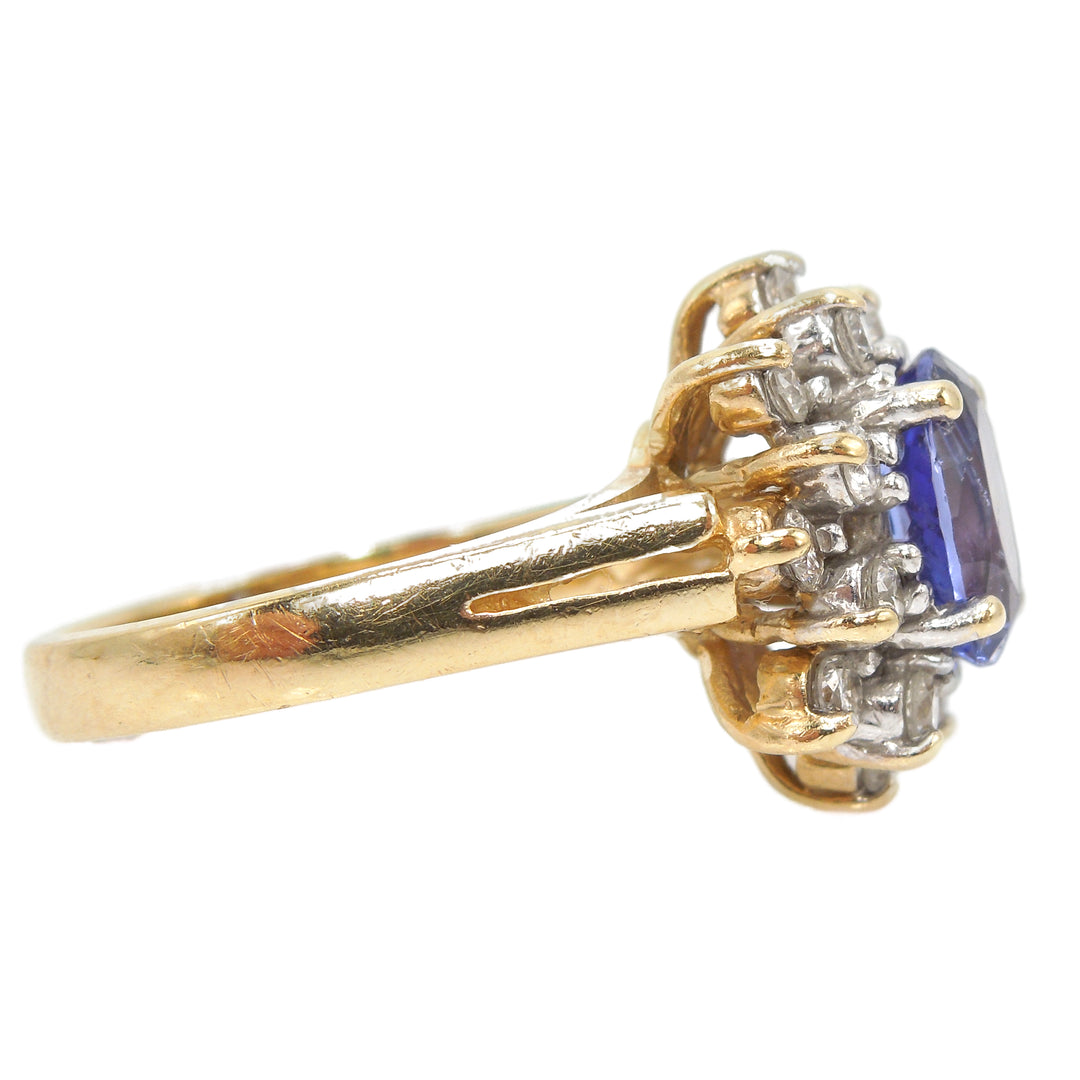 Oval Tanzanite in Yellow Gold with 1ct Diamond Cluster