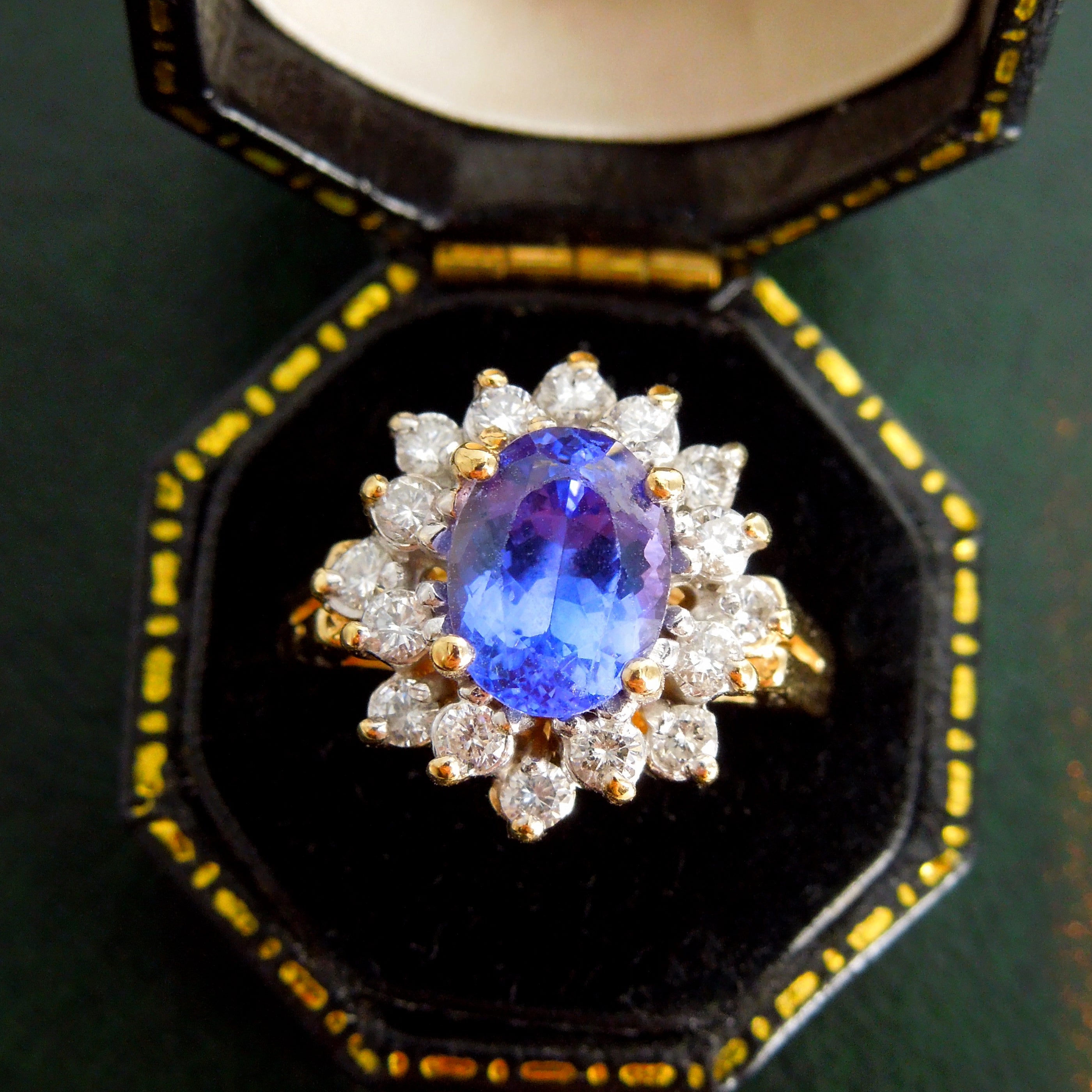 Oval Tanzanite in Yellow Gold with 1ct Diamond Cluster