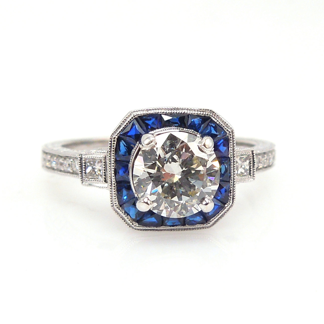 Art Deco Style Light Carat Diamond Ring with Sapphire Halo in White Gold