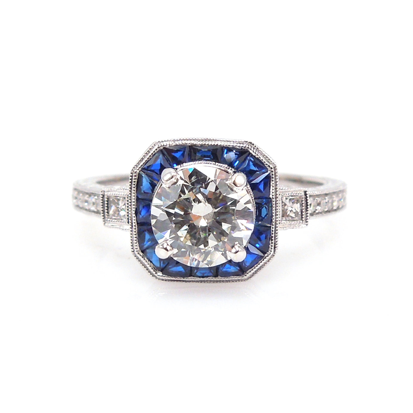 Art Deco Style Light Carat Diamond Ring with Sapphire Halo in White Gold