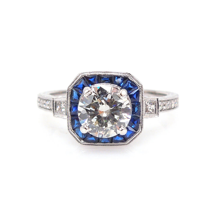 Art Deco Style Light Carat Diamond Ring with Sapphire Halo in White Gold