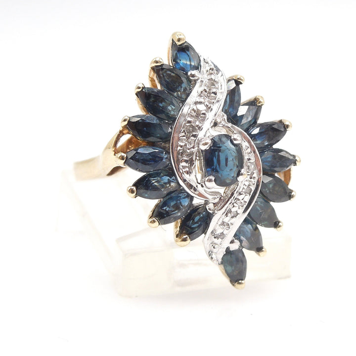 Large Sapphire and Diamond Hurricane Swirl Ring in Yellow Gold