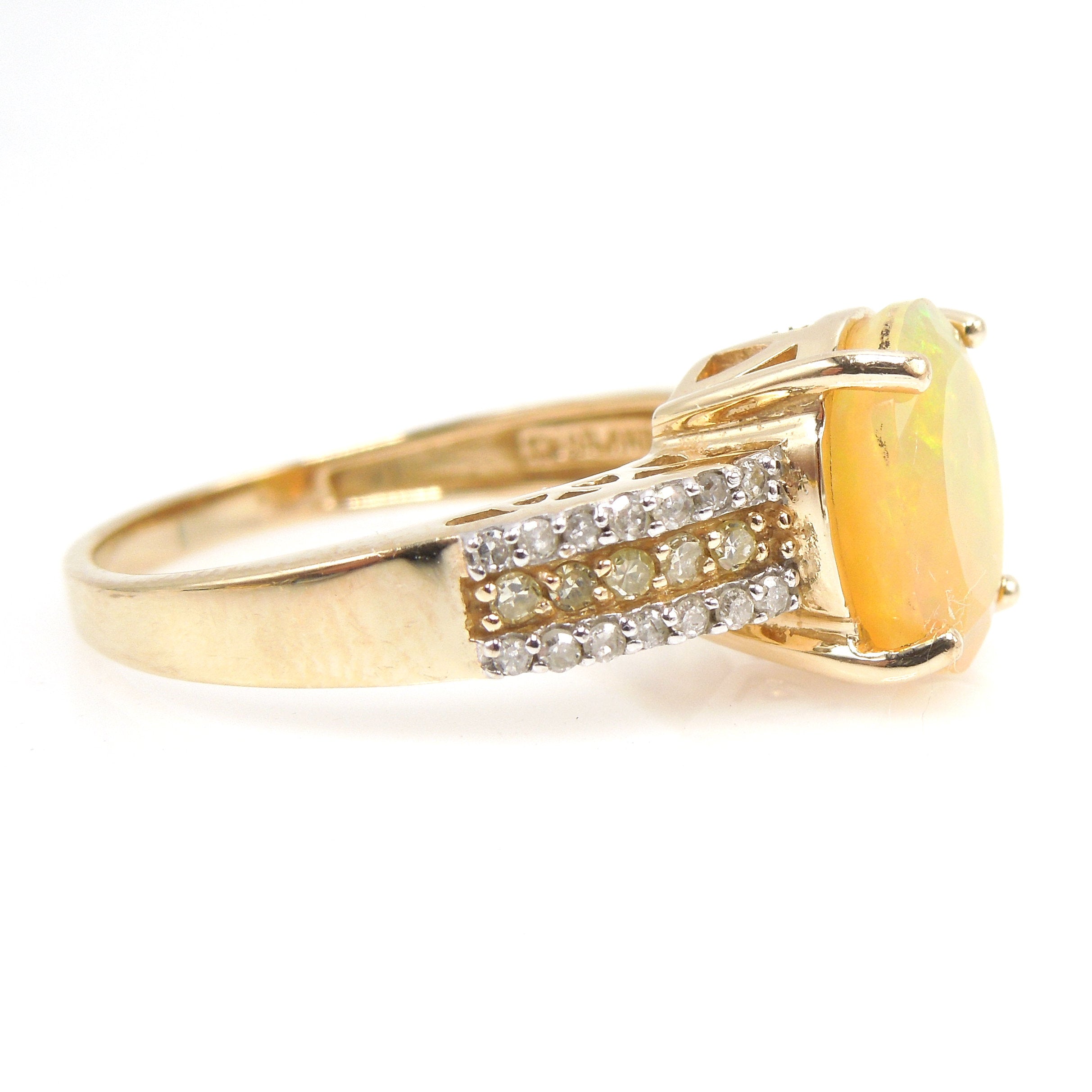 Faceted Fiery Gray Crystal Opal Ring with White Diamonds and Yellow Diamonds in Yellow Gold