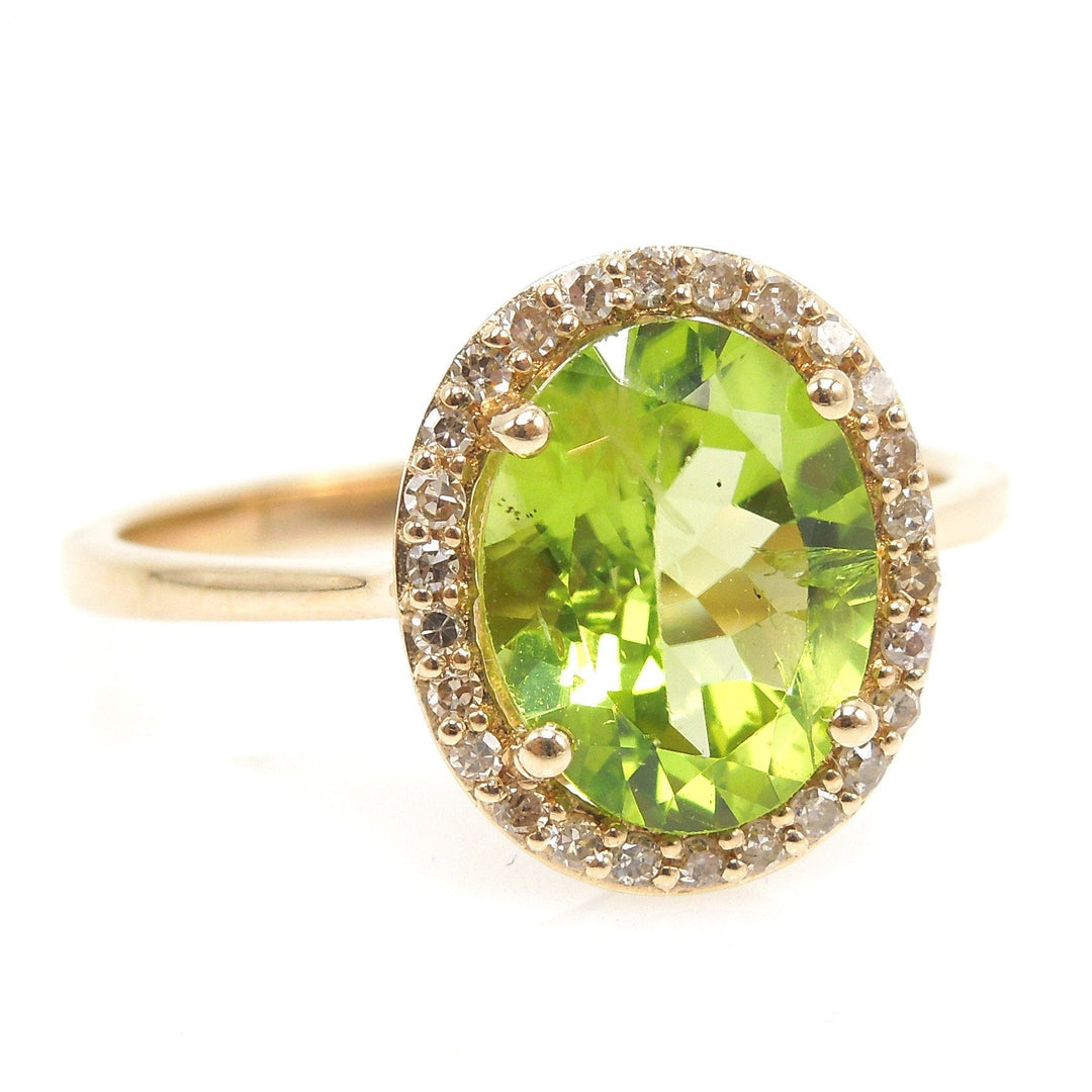 Large Oval Peridot Ring with Diamond Halo in Yellow Gold