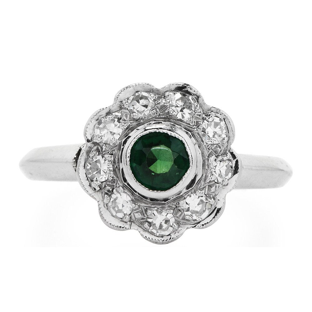 Vintage Emerald and Diamond Floral Halo Ring in Platinum