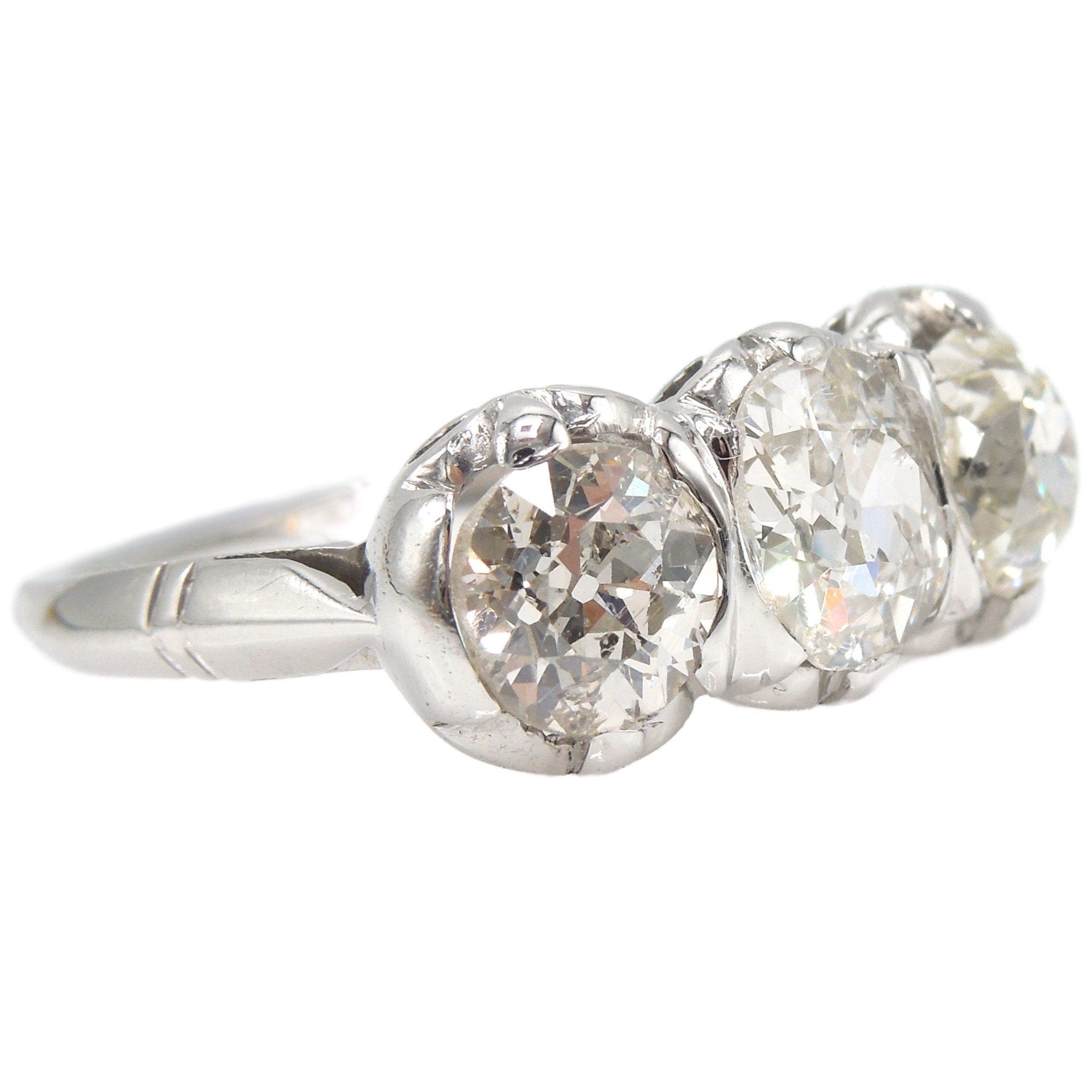 Filigree Art Deco Three Stone Old Mine Cut Diamond Ring in Platinum