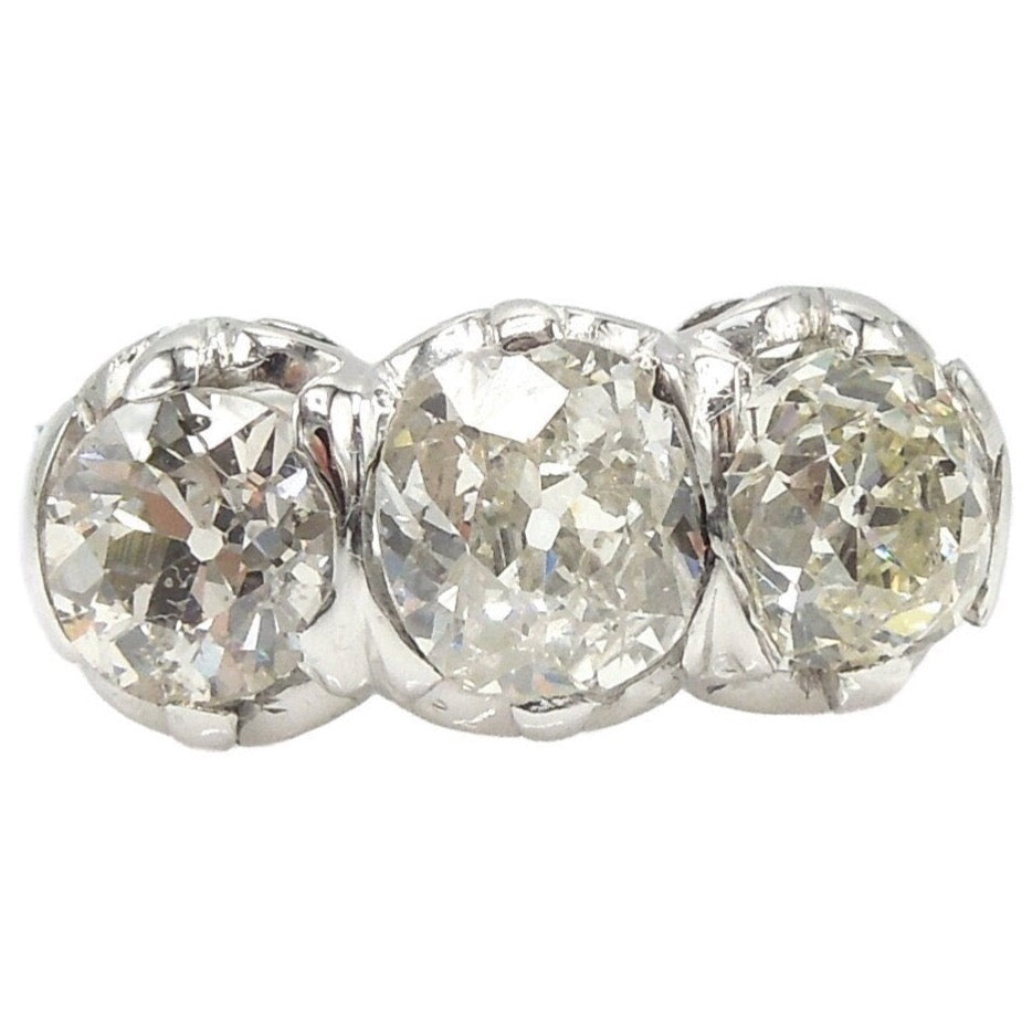 Filigree Art Deco Three Stone Old Mine Cut Diamond Ring in Platinum