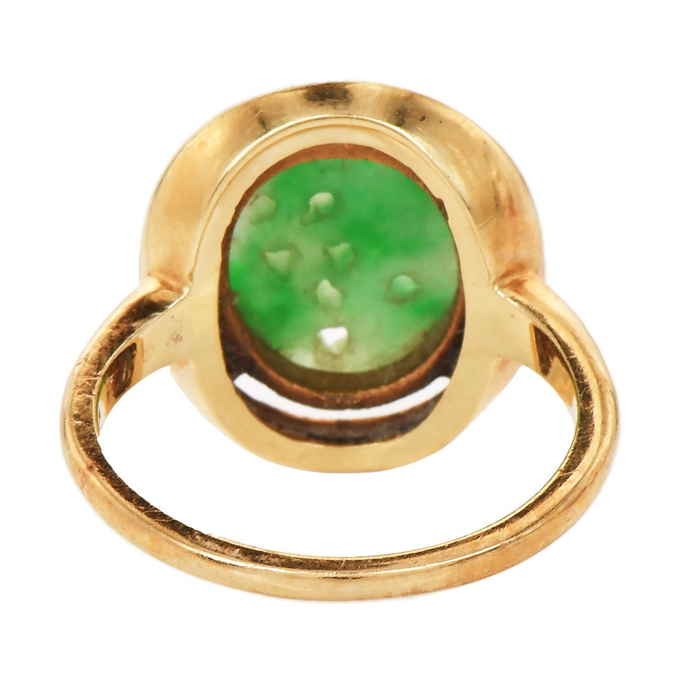 Oval Shaped Floral Carved Jade Piece in 14K Yellow Gold Ring