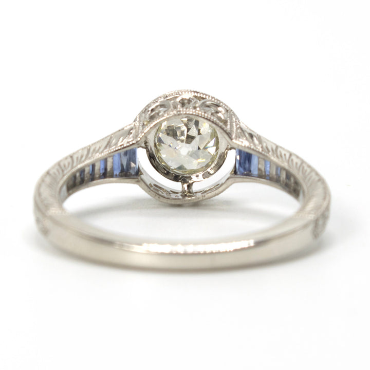 Art Deco Style Bezel Set 0.71 ct European Cut Diamond in Sapphire Accented Solitaire with Airline in Platinum