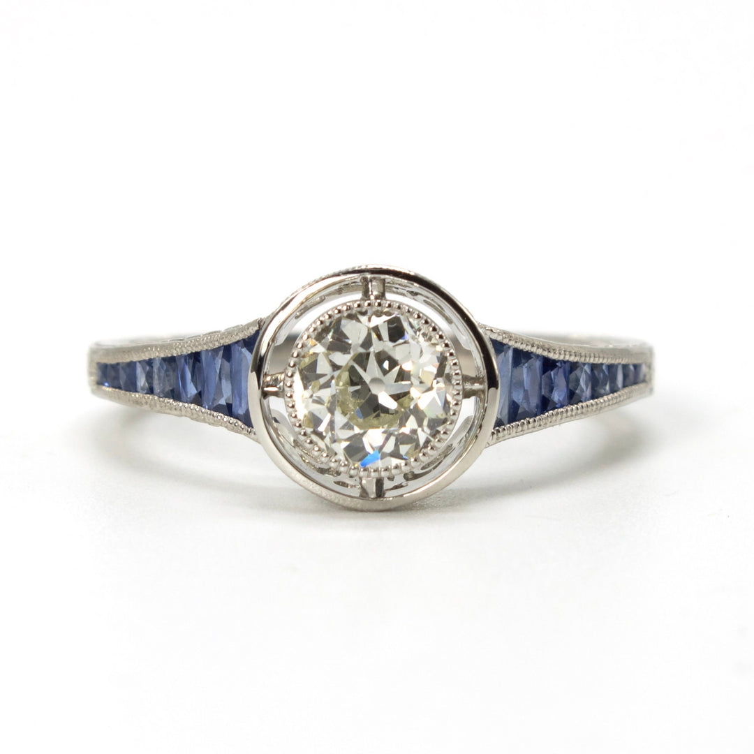Art Deco Style Bezel Set 0.71 ct European Cut Diamond in Sapphire Accented Solitaire with Airline in Platinum